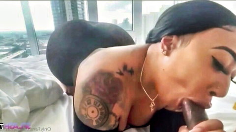Tattooed ebony BBW with huge black ass sucks massive dildo POV closeup