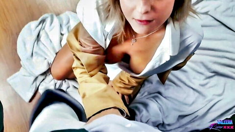 Blonde Attack on Titan scout cosplay with deep cleavage in open uniform shirt