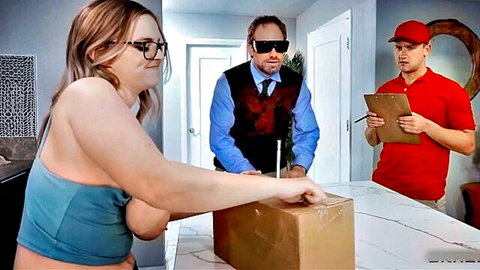 Blonde glasses babe with big tits in tank top holding package with two delivery guys in kitchen