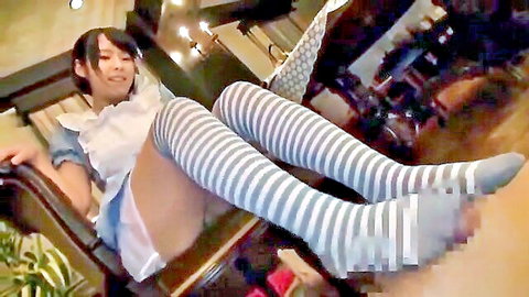 Petite Japanese maid in frilly apron dress spreads legs wide flashing panty-covered pussy in striped thigh-highs