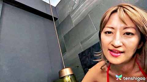 Rena Fukiishi smiling in red bikini, Asian big tits JAV tease