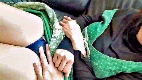 41yo mature Japanese MILF in green dress lifts skirt, reveals blue panties, teasing pose