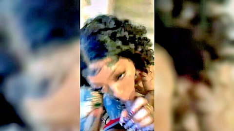 Close-up of curly-haired ebony woman in teasing oral pose