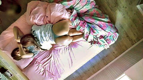 Brunette in white tee and pink panties, ass up on bed, teasing for cum breakfast