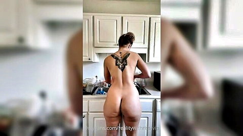 Nude tattooed woman with big ass washing dishes from behind