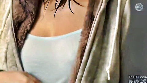 Japanese woman with wet hair, deep cleavage in white tank top and open hoodie, teasing JAV scene