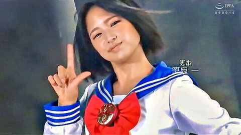 Cute Japanese schoolgirl in sailor uniform smiles and flashes peace sign teasing her perky tits