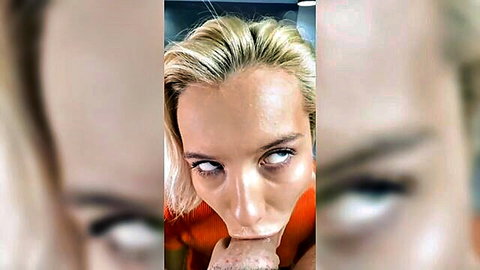 Seductive blonde woman with intense blue eyes and pursed lips in orange top