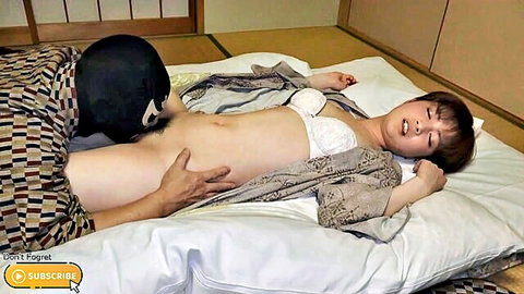 Masked man eagerly performs cunnilingus on Asian babe's exposed shaved pussy in open kimono on tatami bed