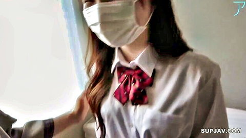 Masked Japanese schoolgirl in white blouse and red bow tie teases POV