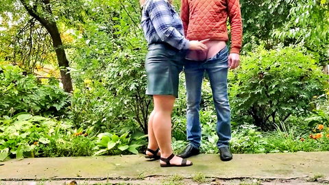 Stepmom gropes stepson's bare ass outdoors in tight leather skirt