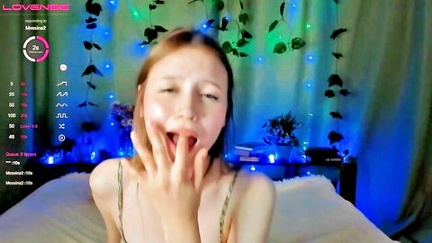 Redhead webcam girl wide mouth open tongue out ahegao face slipping thin top teasing on bed