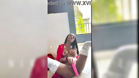 Petite ebony babe exposes tits and spreads legs to fuck pussy with pink dildo in lace stockings