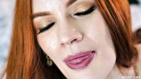 Seductive close-up of redhead Erin Everheart's glossy lips and eyes