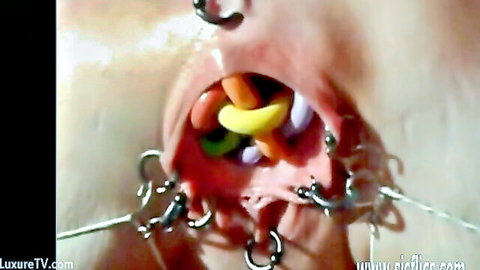 Mature woman stretches pierced pussy with colorful insertions in Sicflics