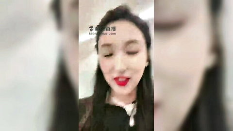Seductive Chinese beauty with red lips and sultry wink close-up