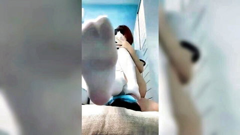 Asian femdom mistress teases submissive man with socked feet POV on bed