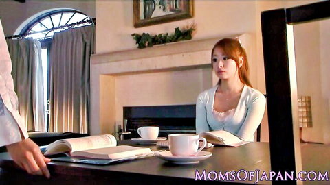 Red-haired Asian MILF in white off-shoulder top at tea table