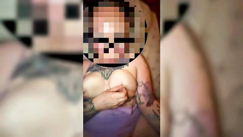 Tattooed ebony MILF covers large breasts in purple lingerie