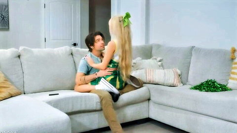 Riley Star as blonde cheerleader straddles man on couch