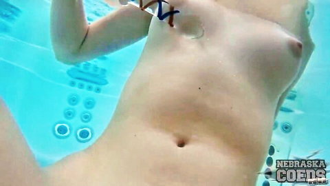 Brunette teen teases nude in hot tub underwater