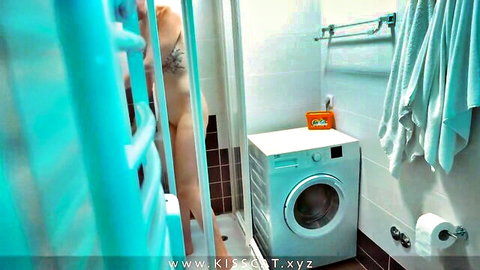 Curvy stepmom in blue lingerie teases in bathroom, shaved pussy hint