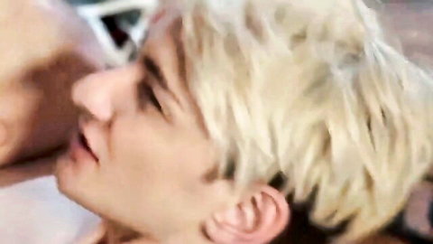 Blonde twink's ecstatic moaning face during intense gay blowjob orgasm