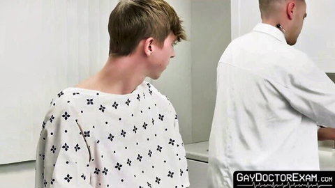 Blonde twink Andrew Powers in gown with doctor Trent Summers at checkup