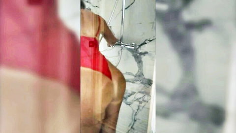 Curvy stepmom in wet red bikini posing in steamy shower after photoshoot