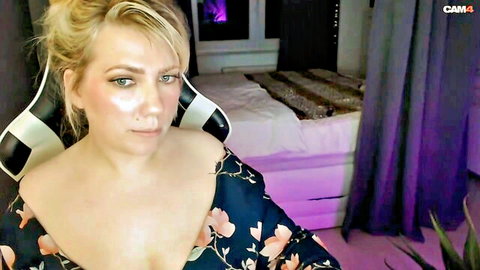 Curvy blonde obese German camgirl in low-cut floral dress showing cleavage