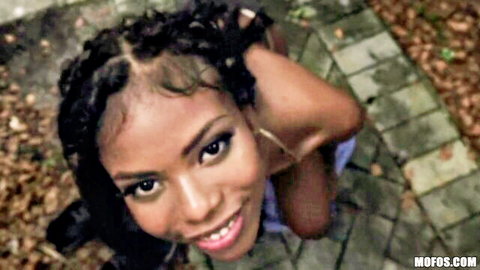 Nia Nacci POV closeup, smiling black babe with braids in seductive pose