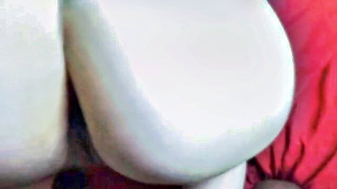 POV closeup of massive pale white ass cheeks split by thin red thong
