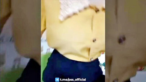 Sexy slim girl teasing by showing her round butt in open yellow top and tight black pants