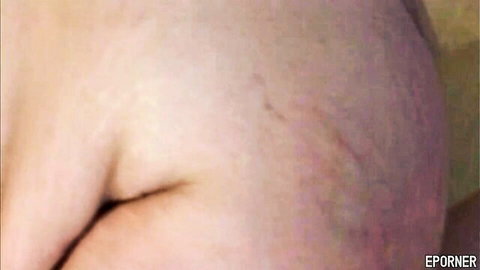 Close-up of alluring BBW mommy's curvy pale hip and thigh in sex scene