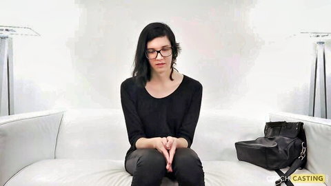Shy nerd teen Misa in glasses and black outfit for couch casting