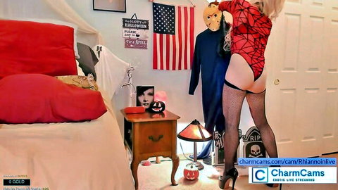 Blonde Halloween cam girl bends over in red fishnet bodysuit showing juicy ass cheeks and thong