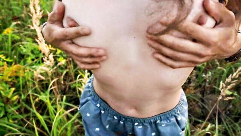 Amateur man showing his naked torso outdoors
