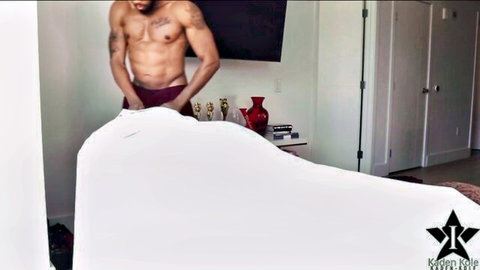 Muscular tattooed BBC stud in tight maroon briefs gripping white sheet tease