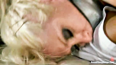 Slutty blonde in white tank top from parking lot gangbang scene
