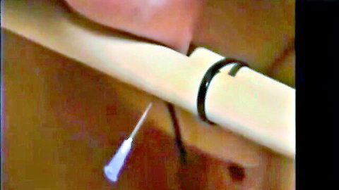Blonde slave tit torture with syringe needle BDSM
