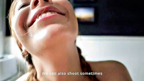 Ecstatic redhead smiling wide with teeth showing in POV closeup