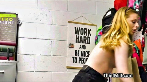 Blonde MILF topless showing bare back in tight jeans in locker room with motivational poster