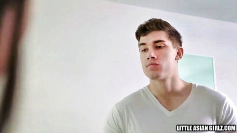 Handsome muscular guy in white V-neck shirt smirks in Asian porn teaser
