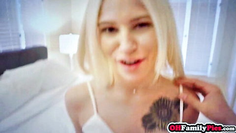 Kiara Cole blonde smiling in white camisole with tattoo, party blowjob tease