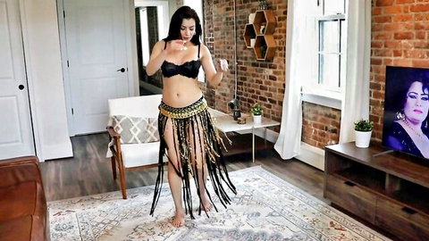 Skinny brunette babe shakes medium tits in black bra and gold fringed skirt in sensual striptease dance