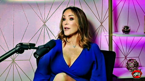 Holly Randall in low-cut blue dress, podcast interview with Rachel Steele on dirty talk