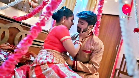 Indian couple in saree and kurta sharing passionate embrace