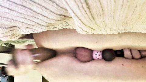 Sissy in chastity sissygasm with dildo insertion and anal beads close-up