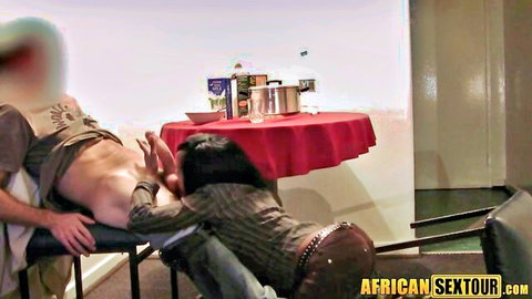 Ebony babe gropes naked white man's big ass on massage table in steamy interracial session