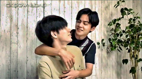 Two young Asian men in intimate back hug embrace